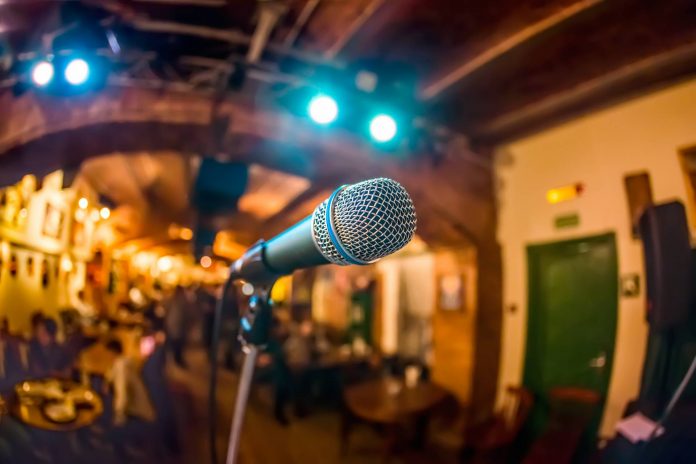 Microphone on stage against a background of auditorium